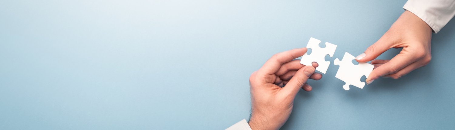 People holds in hand a jigsaw puzzle. Business solutions, succes